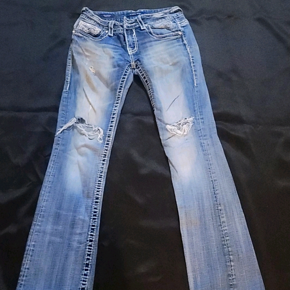 Distressed blue jeans